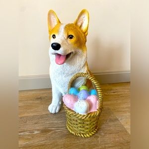 Corgi Easter statue with basket of eggs